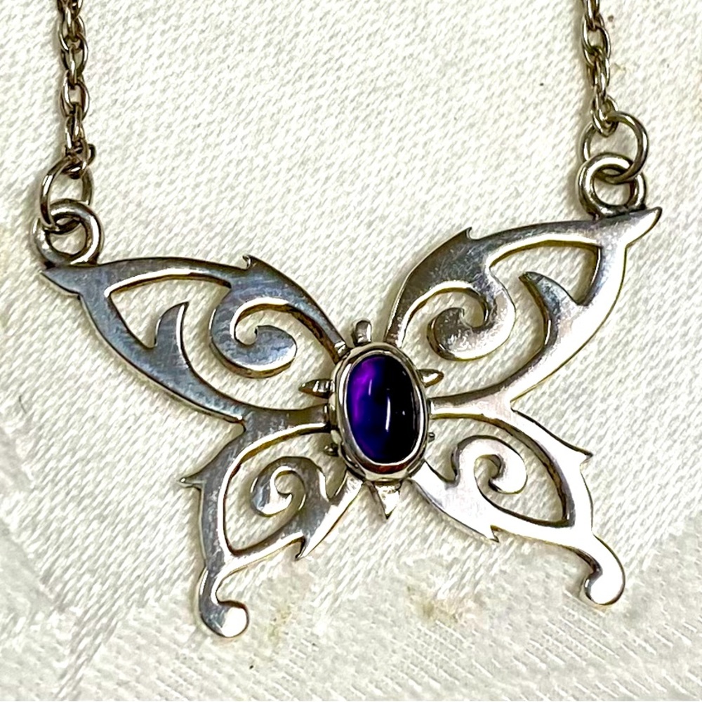 Sterling silver cutout butterfly with amethyst cabochon stone